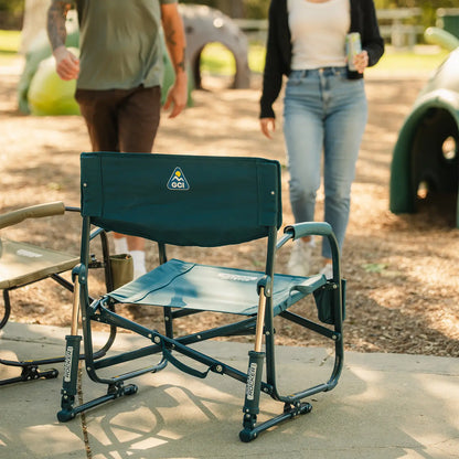 Two people walking away from a playground as they approach two opened Grab and Go Rockers. 